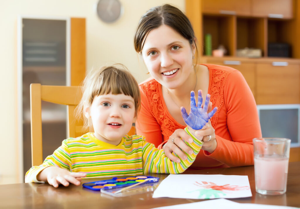 Early Childhood Educator Assistant students guiding children's learning through interactive classroom activities.